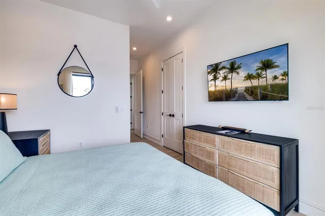 a bed room with a bed and a painting