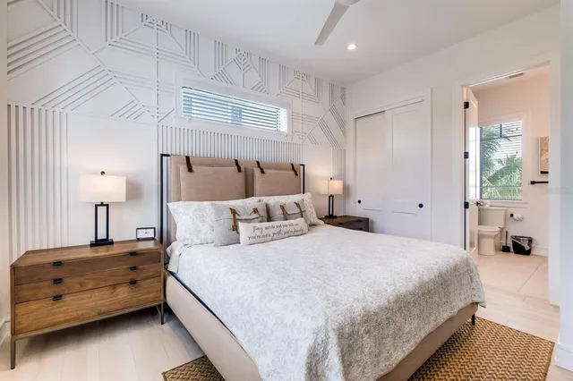a view of balcony with two chairs and a potted plant