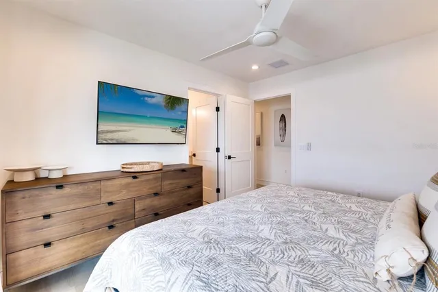 a view of a balcony with wooden floor and a potted plant