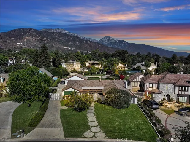 an aerial view of residential houses and outdoor space