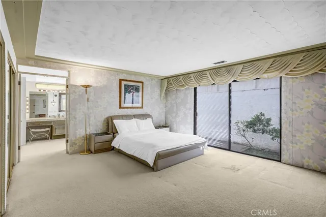 a bedroom with a bed and a table