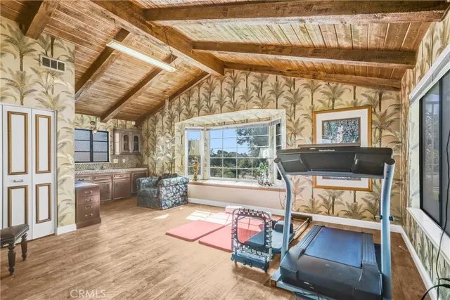 a front view of a house with outdoor space and swimming pool