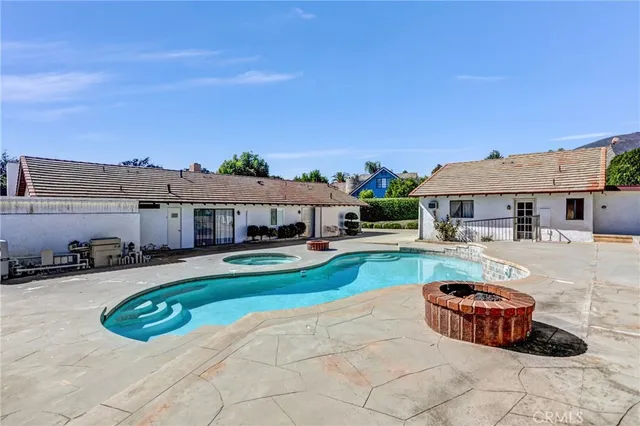 a bathroom with a granite countertop sink vanity mirror and toilet