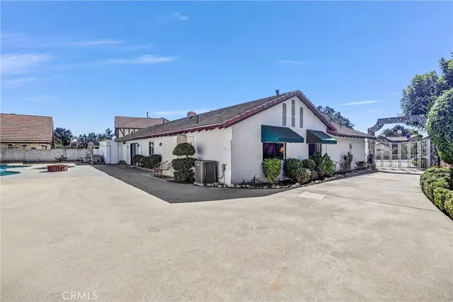 an aerial view of residential house with outdoor space and street view