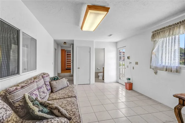 an aerial view of residential house and sandy dunes