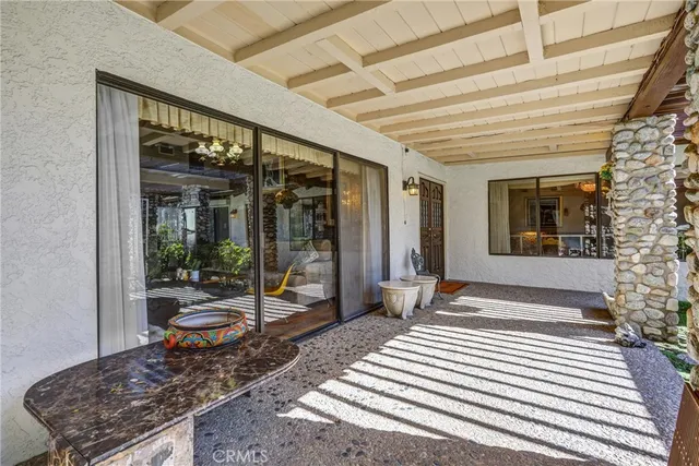 a living room with fireplace furniture and a chandelier