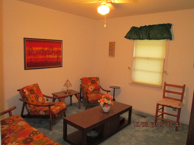 3585 Hamlin Road Lizella, GA 31052 - Photo 12 of 12 a living room with furniture and a window