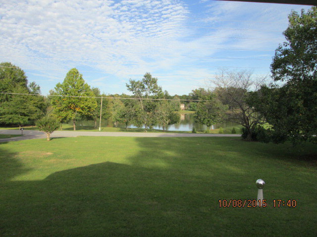 3585 Hamlin Road Lizella, GA 31052 - Photo 3 of 12 a view of a golf course with a lake
