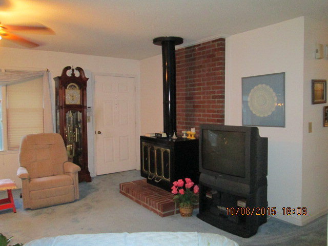 3585 Hamlin Road Lizella, GA 31052 - Photo 9 of 12 a living room with furniture and a flat screen tv