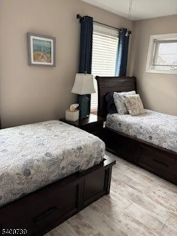 a bedroom with bed and window