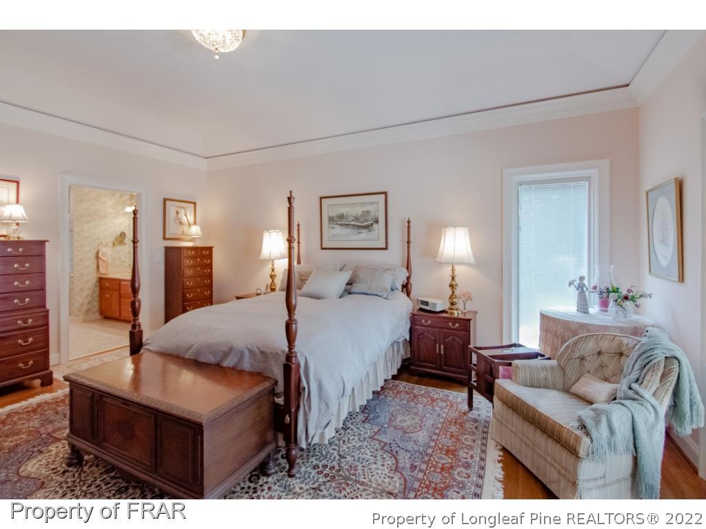 127 Harrell Road West End, NC 27376 - Photo 11 of 27 a bed room with a bed window and couch
