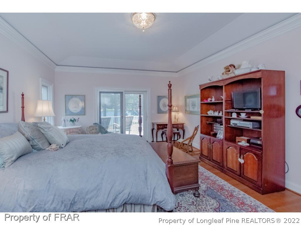 127 Harrell Road West End, NC 27376 - Photo 12 of 27 a bedroom with furniture and a book shelf