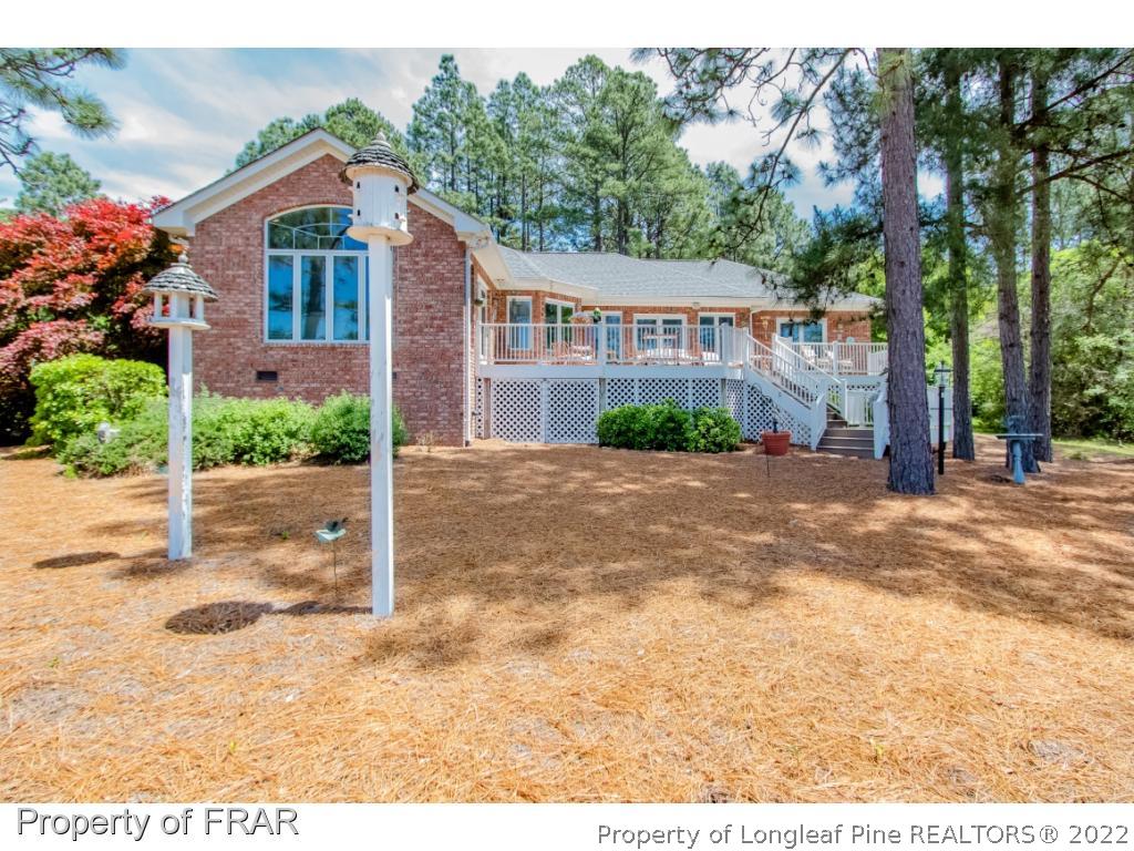 127 Harrell Road West End, NC 27376 - Photo 22 of 27 a front view of a house with a yard and garage