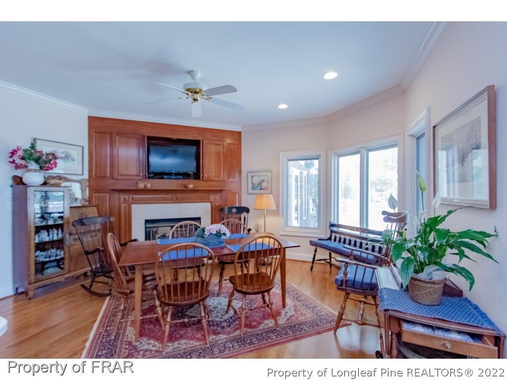 127 Harrell Road West End, NC 27376 - Photo 6 of 27 a living room with furniture a fireplace and a flat screen tv