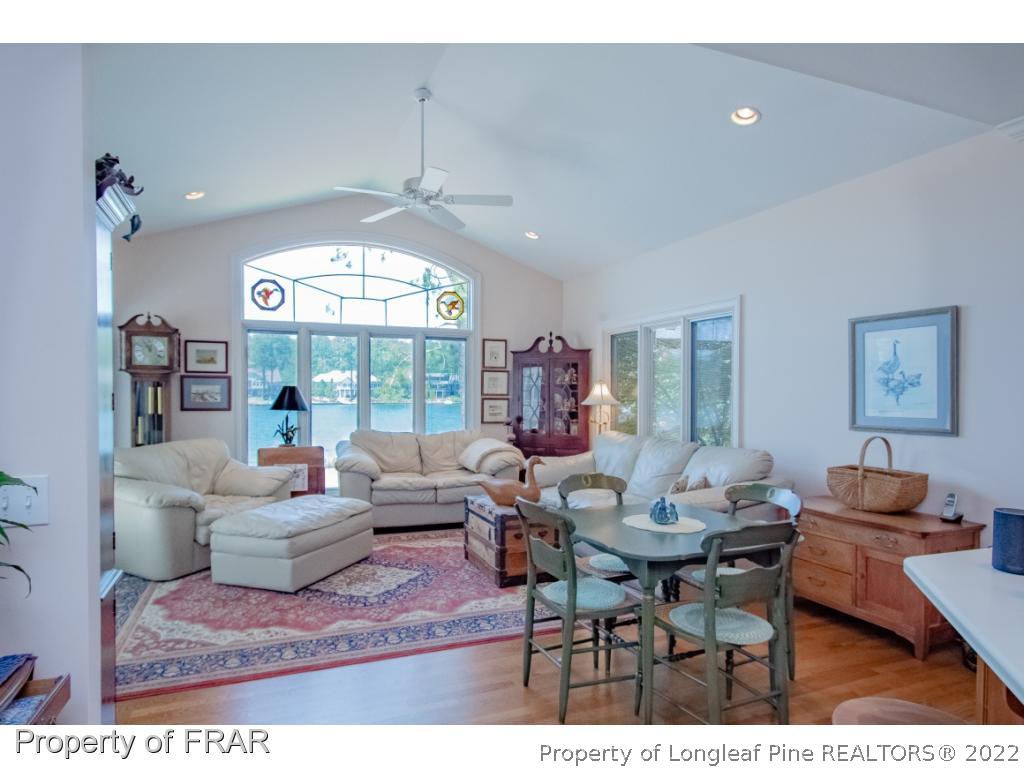 127 Harrell Road West End, NC 27376 - Photo 7 of 27 a living room with furniture a large window and a dining table