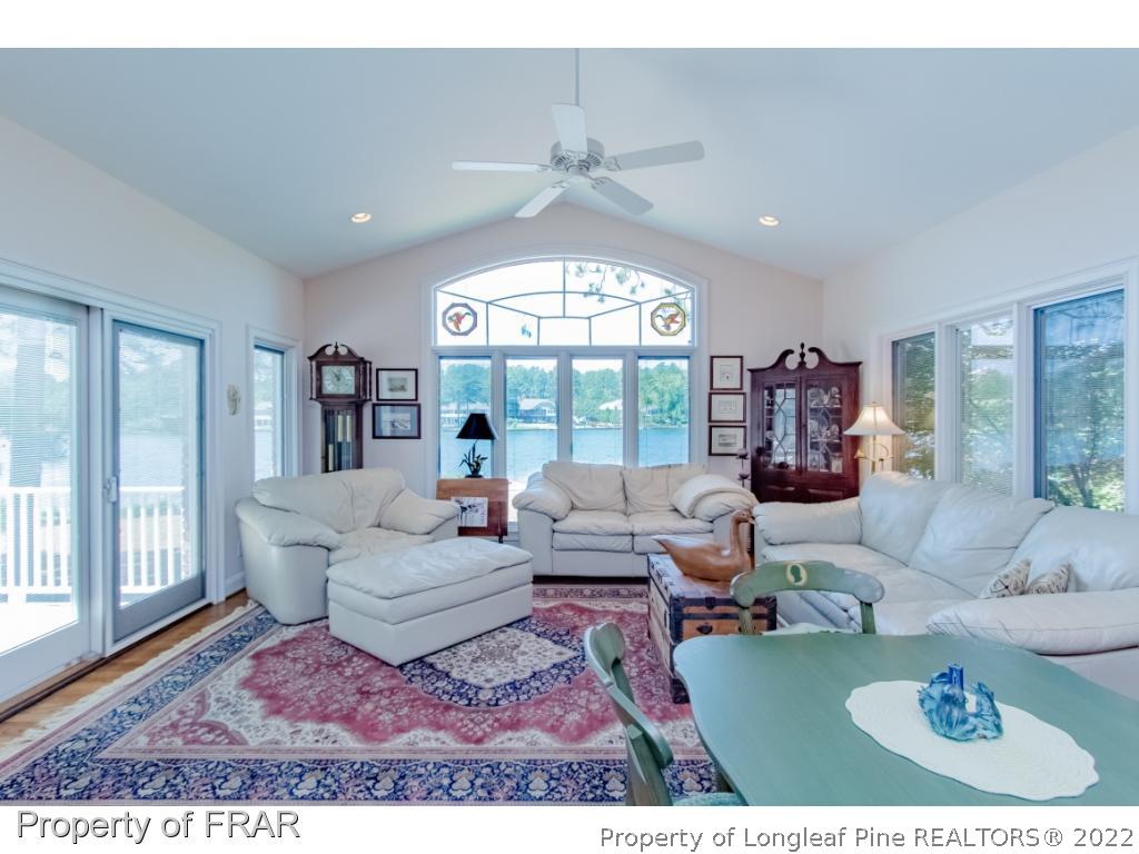 127 Harrell Road West End, NC 27376 - Photo 8 of 27 a living room with furniture a large window and a table
