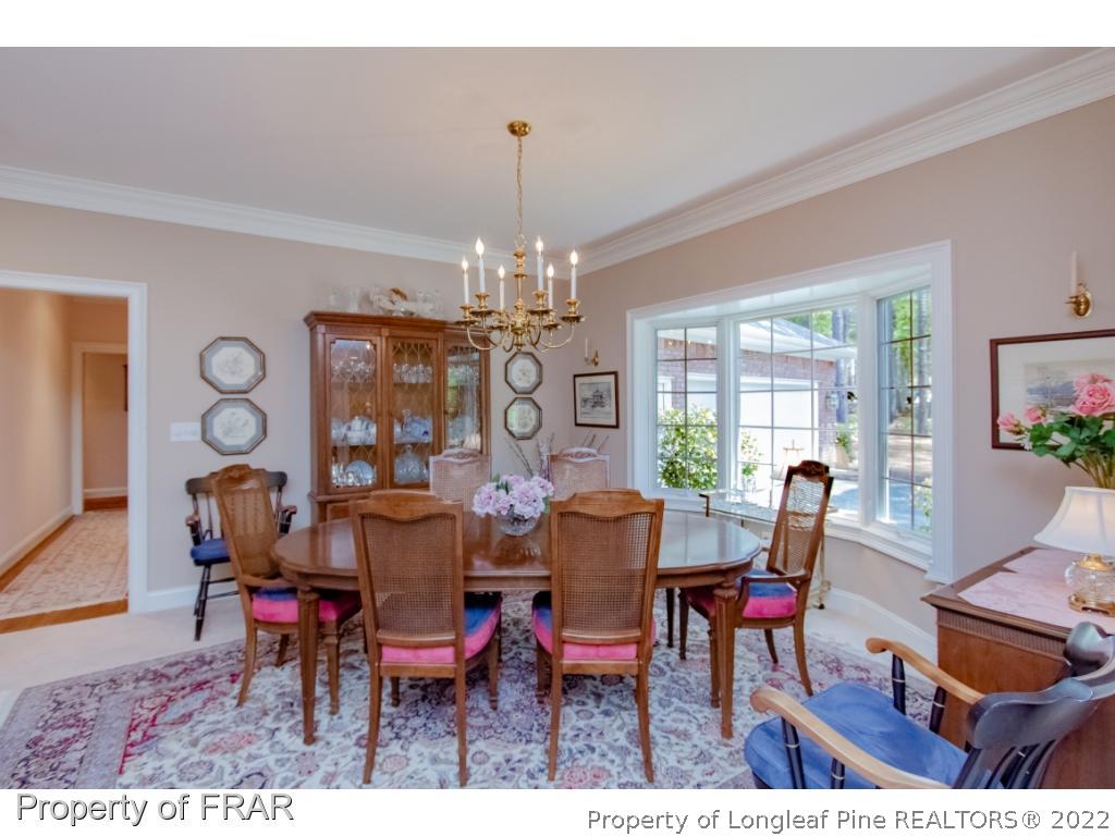 127 Harrell Road West End, NC 27376 - Photo 9 of 27 a view of a dining room with furniture window and outside view