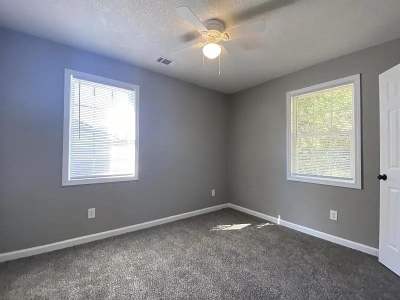 3509 West Horn Lake Road Memphis, TN 38109 - Photo 7 of 8 a view of empty room with windows