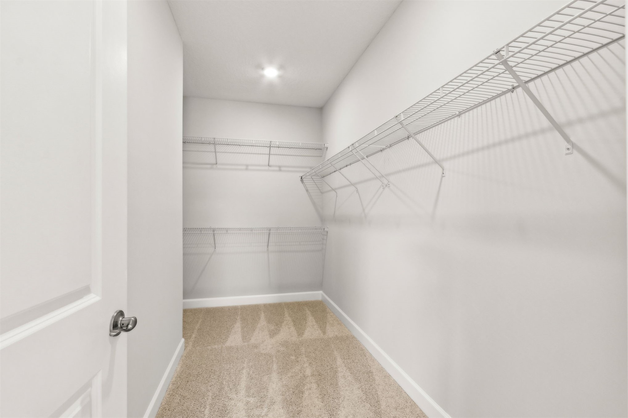 85236 Sandy Rdg Loop Yulee, FL 32097 - Photo 12 of 19 a view of a room with racks on the wall