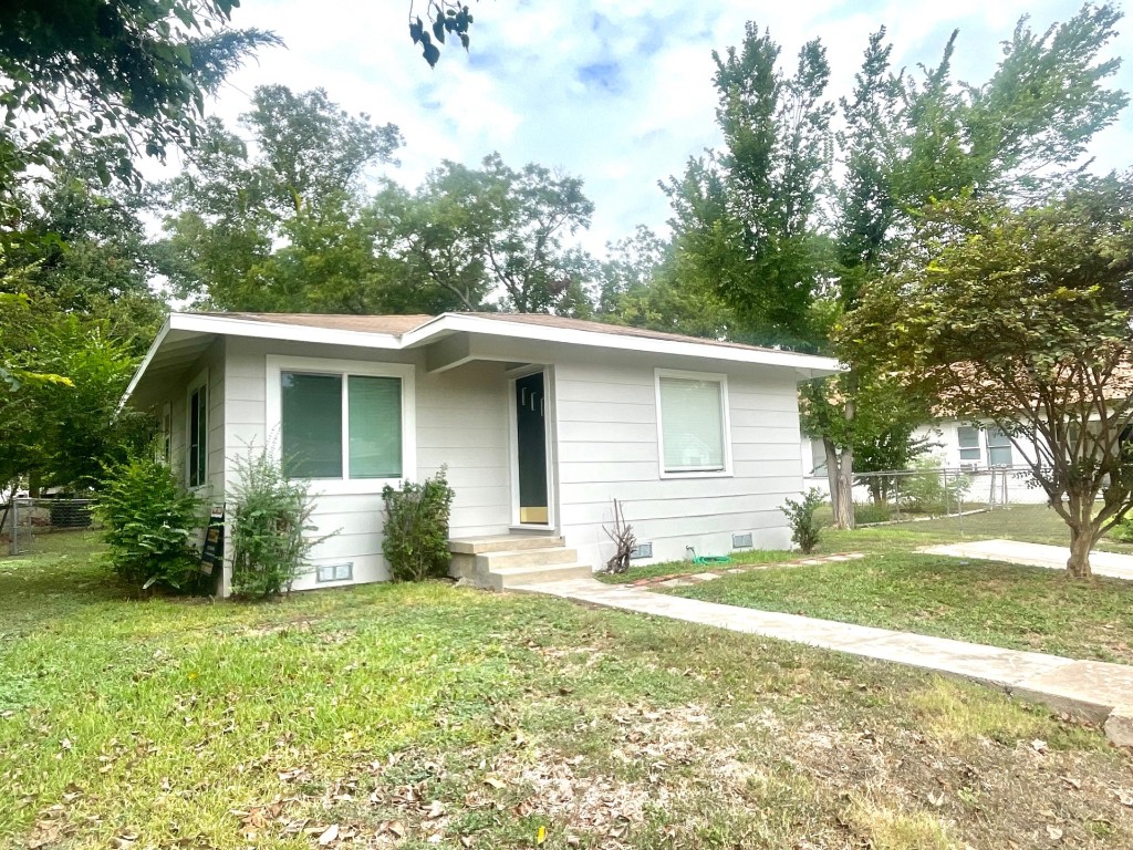 a house view with a garden space