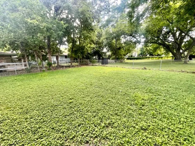 a view of outdoor space with deck and trees