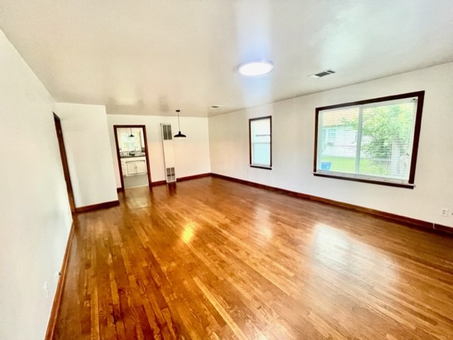 1109 Davis Street Taylor, TX 76574 - Photo 3 of 12 a view of an empty room with windows