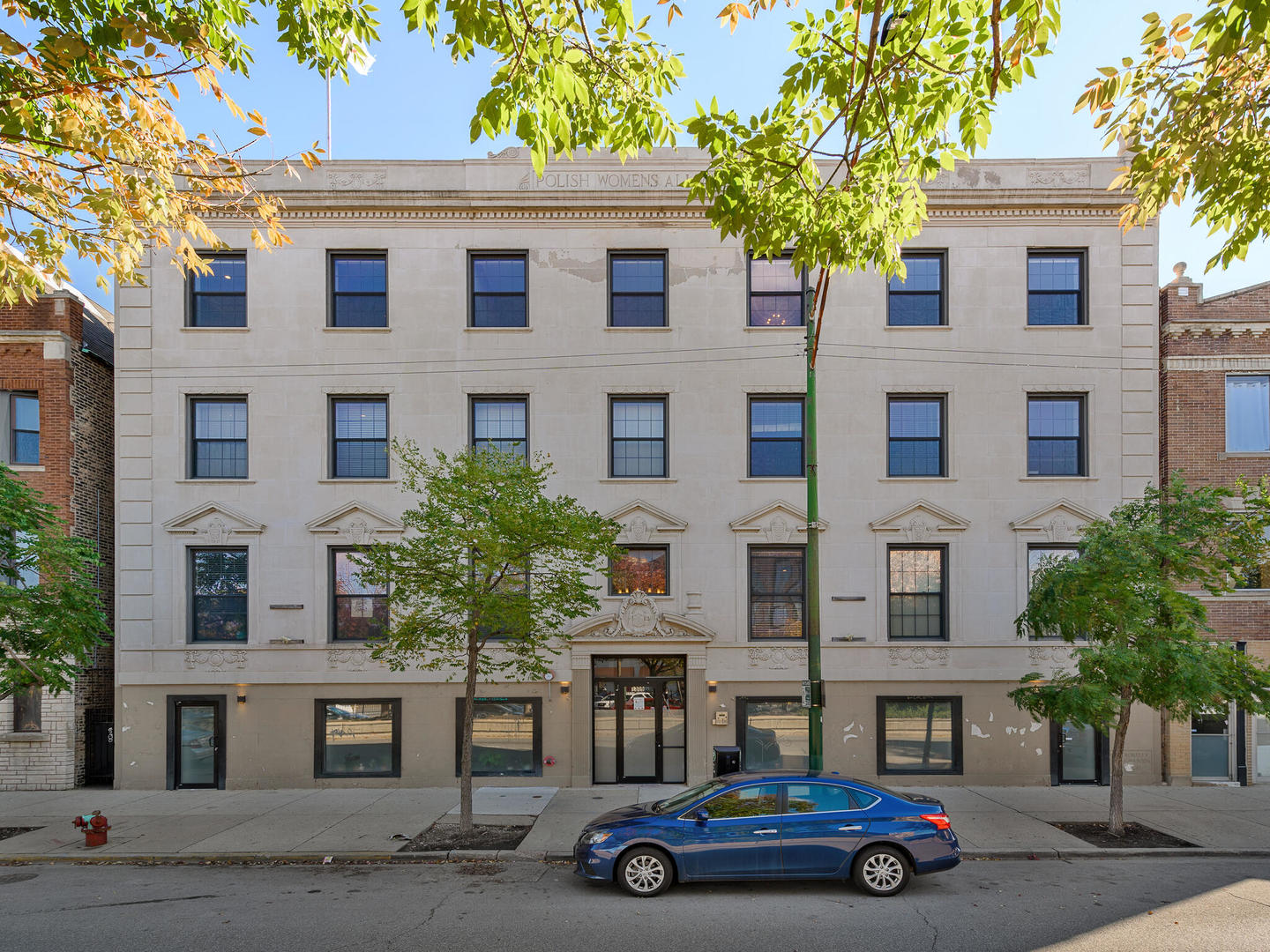 1309 North Ashland Avenue, Unit 401 Chicago, IL 60622 - Photo 1 of 21 a car parked in front of a building