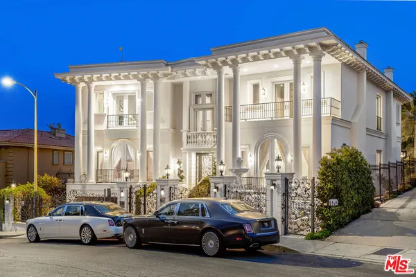 a view of cars parked in front of a building