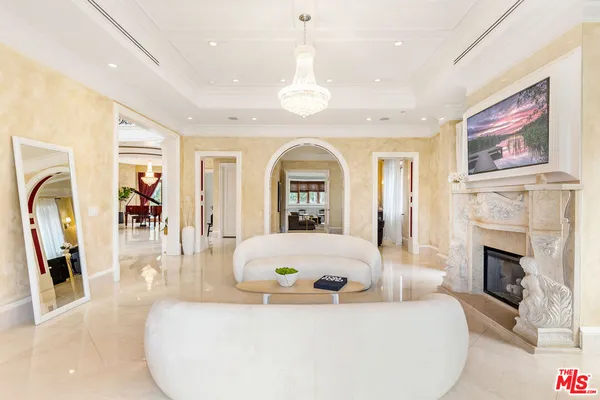 a view of a livingroom with furniture window and wooden floor