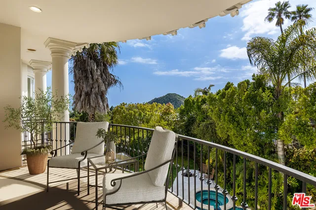 a large white bed in a white room