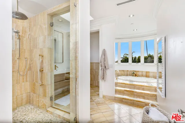 a bedroom with a large bed and a couch