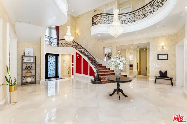 a view of entryway wih livingroom and stairs