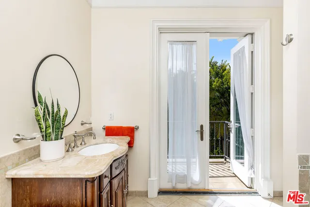 a bedroom with a large bed and a large window