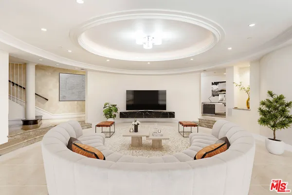 a kitchen with stainless steel appliances granite countertop a sink and a refrigerator