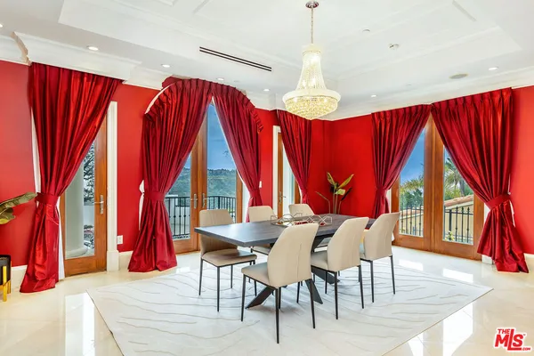 a view of a dining room with furniture and a window