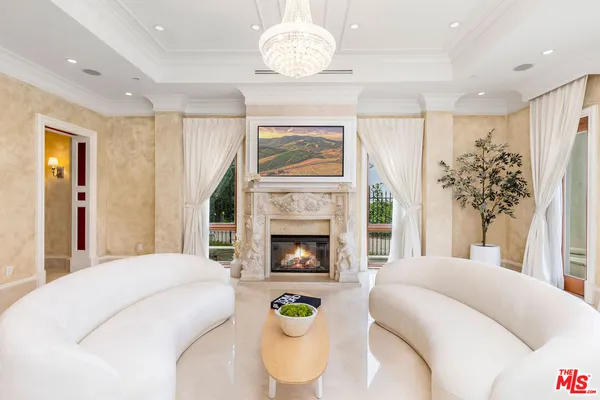a bedroom with a bed and a fireplace