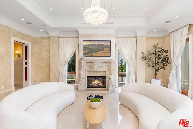 a bedroom with a bed and a fireplace