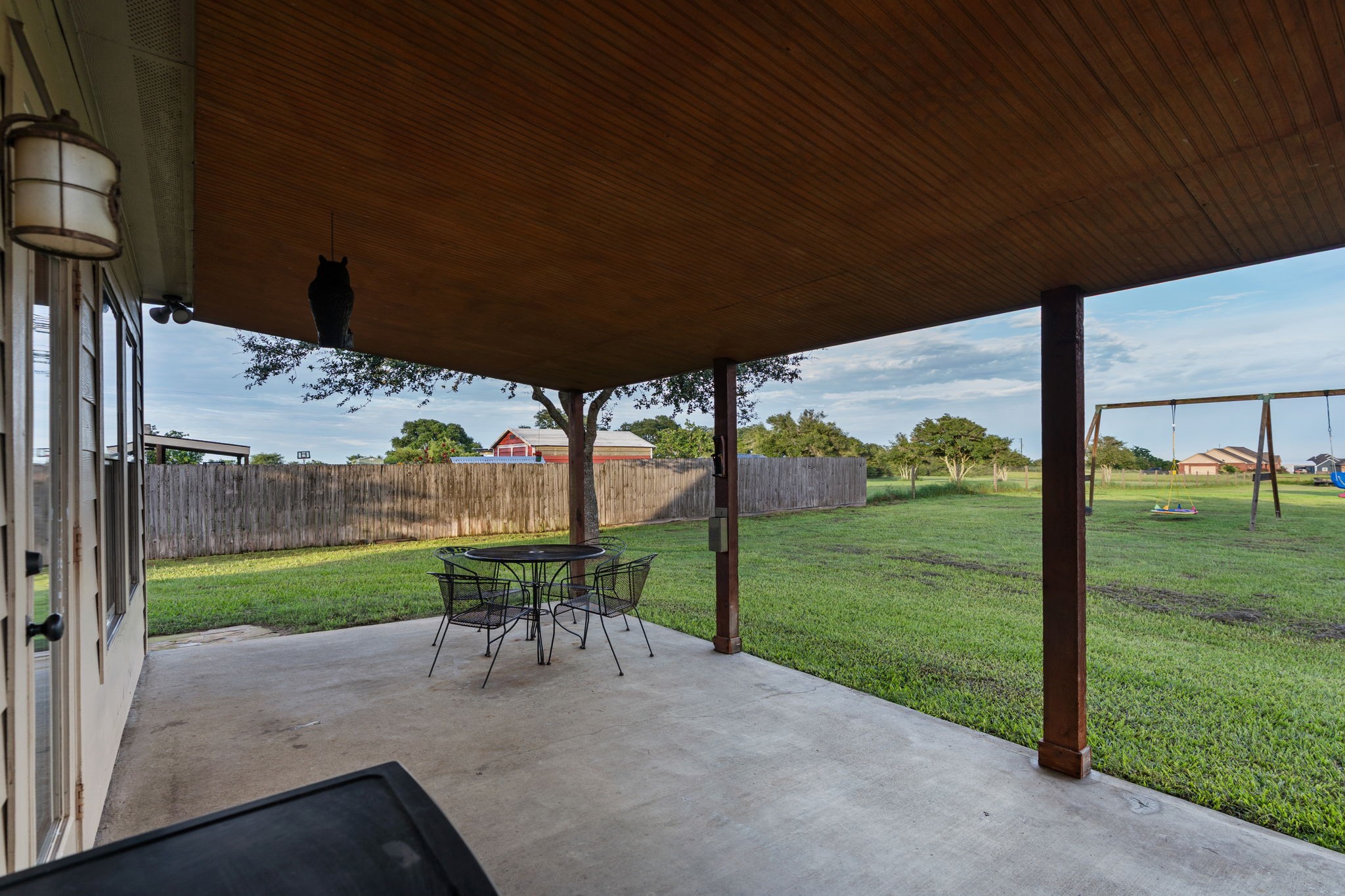 5942 Wildflower Road Sealy, TX 77474 - Photo 24 of 41 a view of a porch with furniture and garden