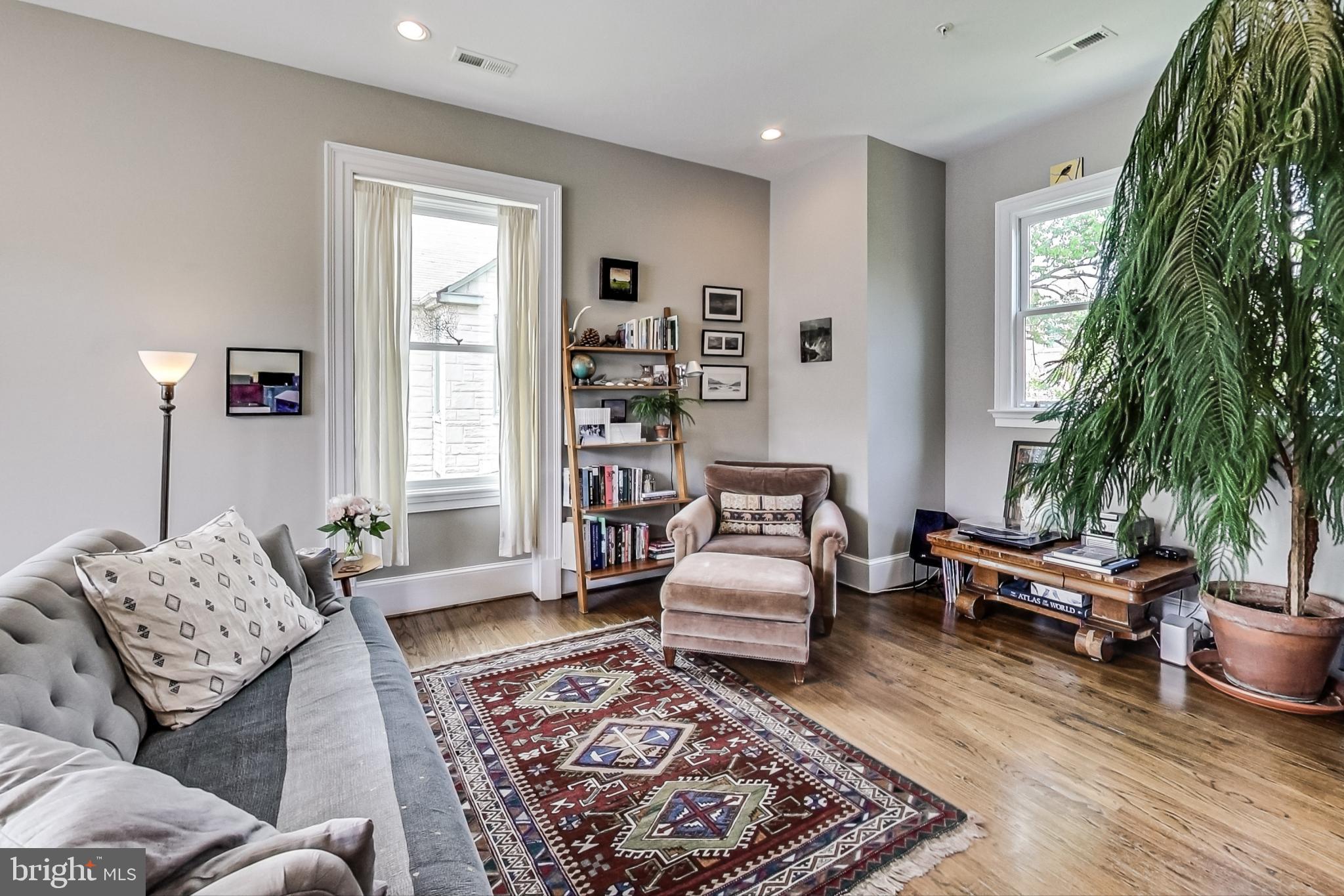 3324 18th Street Northwest, Unit 9 Washington, DC 20010 - Photo 11 of 44 a living room with furniture and a rug