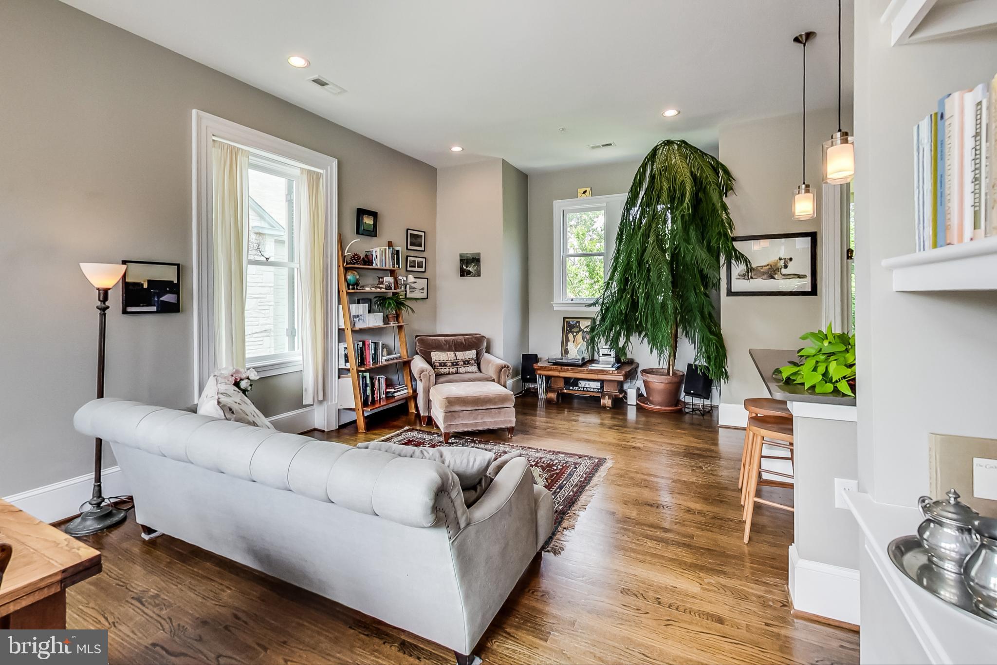3324 18th Street Northwest, Unit 9 Washington, DC 20010 - Photo 13 of 44 a living room with furniture and a chandelier