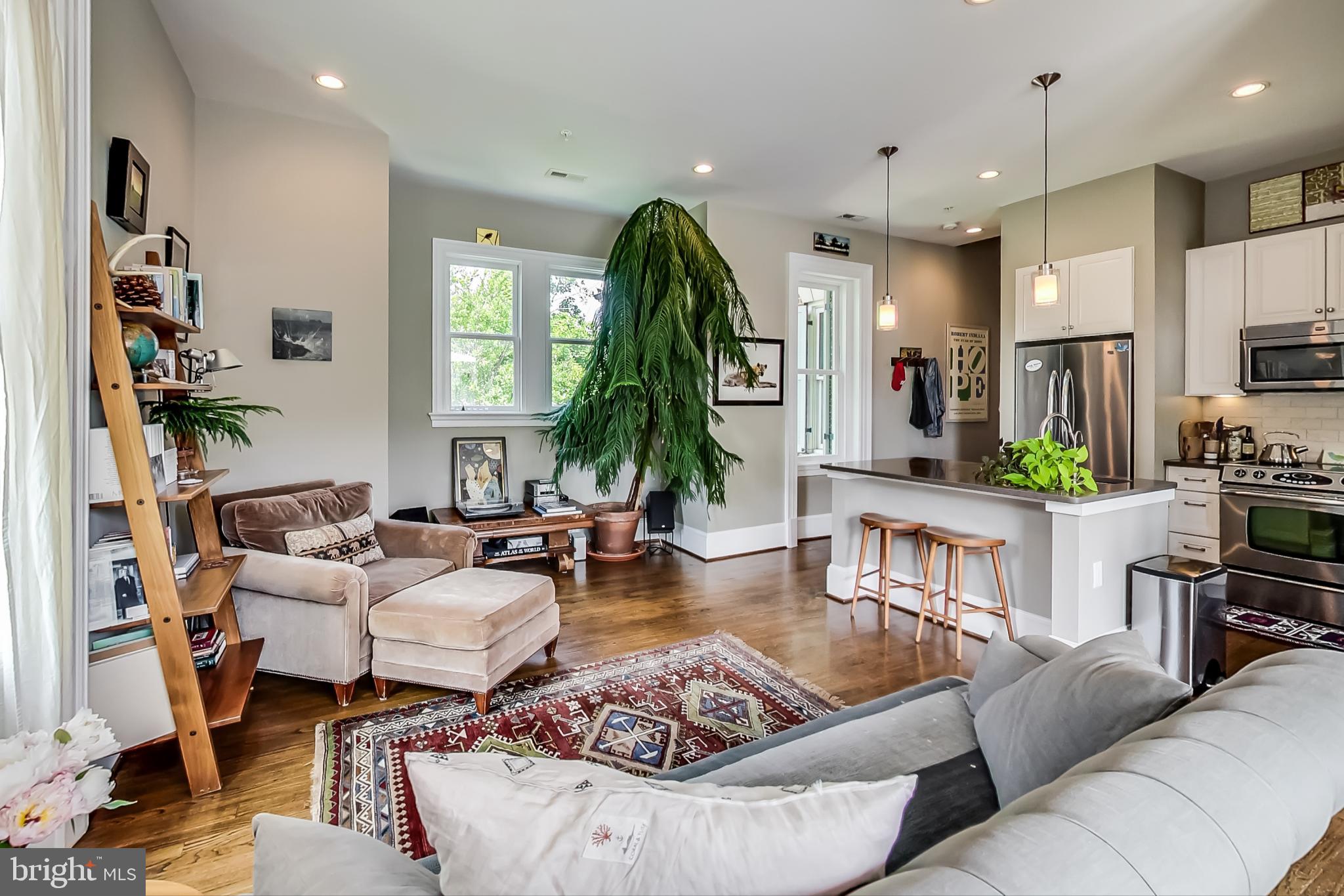 3324 18th Street Northwest, Unit 9 Washington, DC 20010 - Photo 14 of 44 a living room with furniture kitchen view and a large window