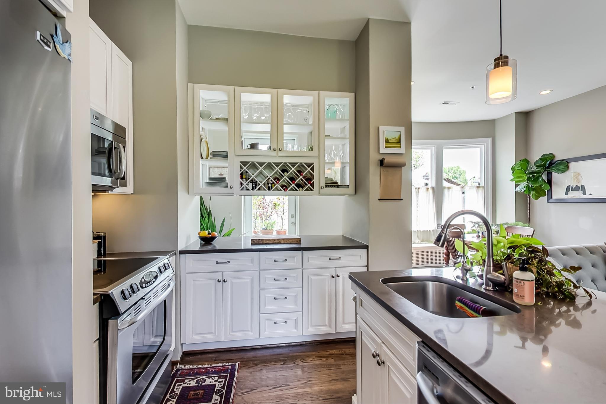 3324 18th Street Northwest, Unit 9 Washington, DC 20010 - Photo 17 of 44 a kitchen with granite countertop a sink stove and cabinets