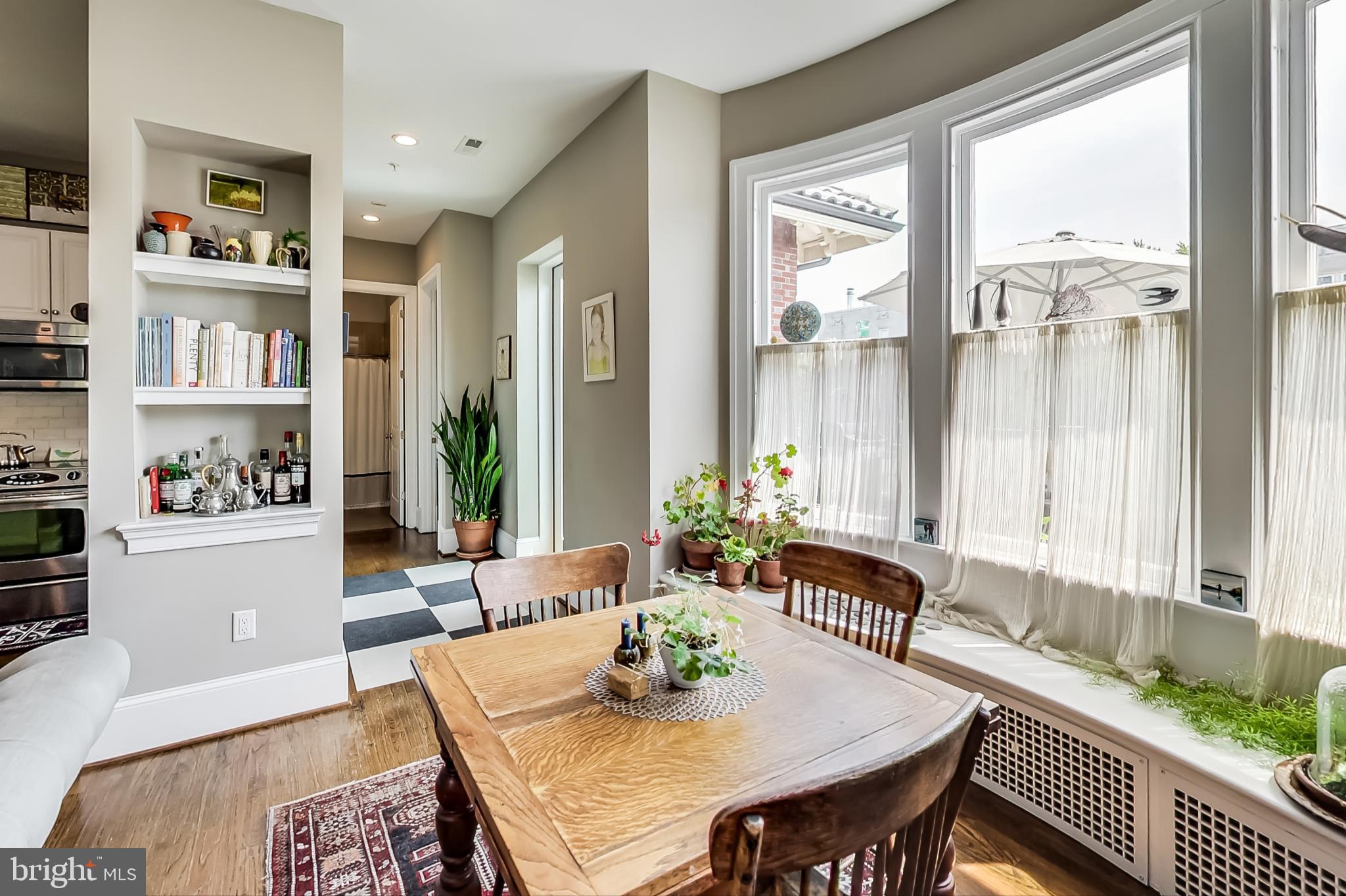 3324 18th Street Northwest, Unit 9 Washington, DC 20010 - Photo 18 of 44 a view of a dining room with furniture window and wooden floor