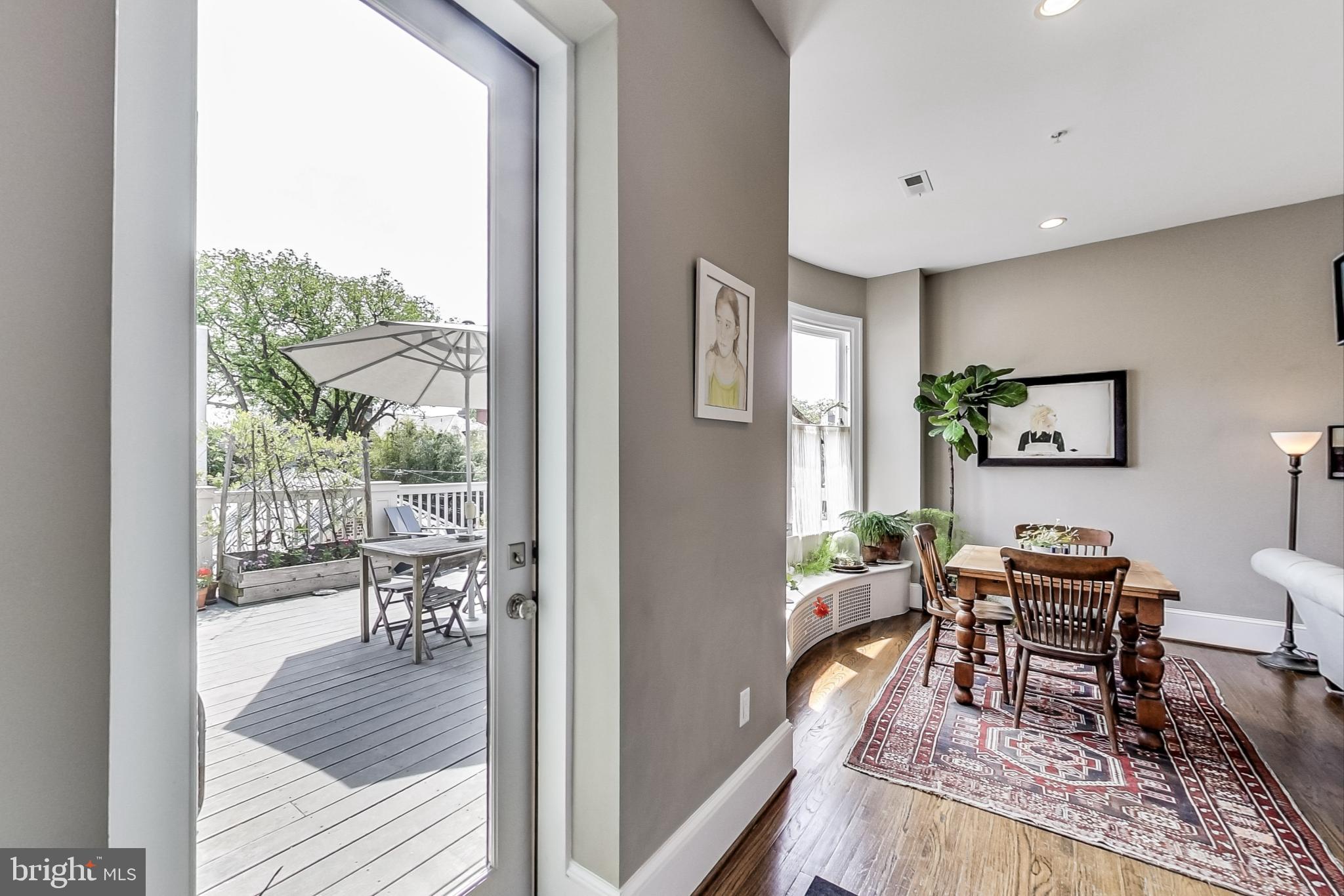 3324 18th Street Northwest, Unit 9 Washington, DC 20010 - Photo 19 of 44 a living room with furniture and a floor to ceiling window