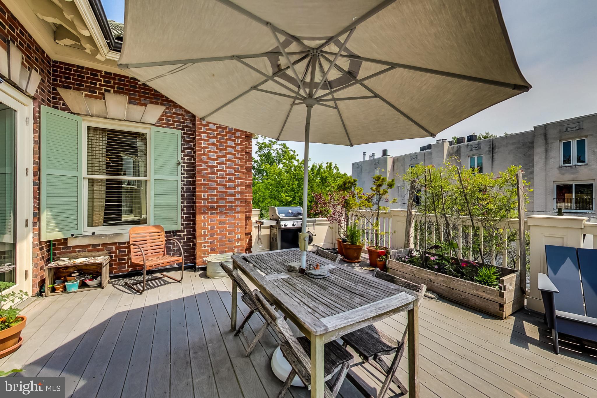 3324 18th Street Northwest, Unit 9 Washington, DC 20010 - Photo 21 of 44 an outdoor space with furniture and umbrella