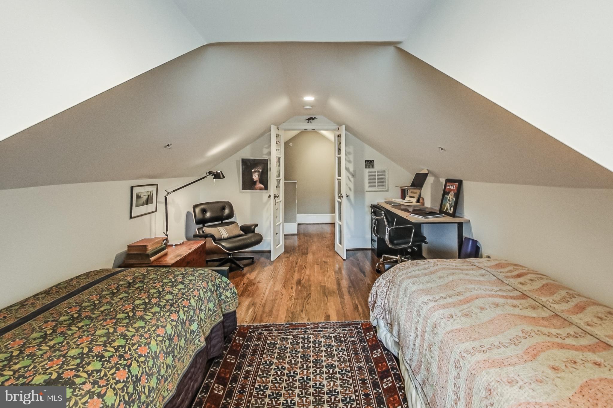 3324 18th Street Northwest, Unit 9 Washington, DC 20010 - Photo 31 of 44 a bed room with a bed and a chair