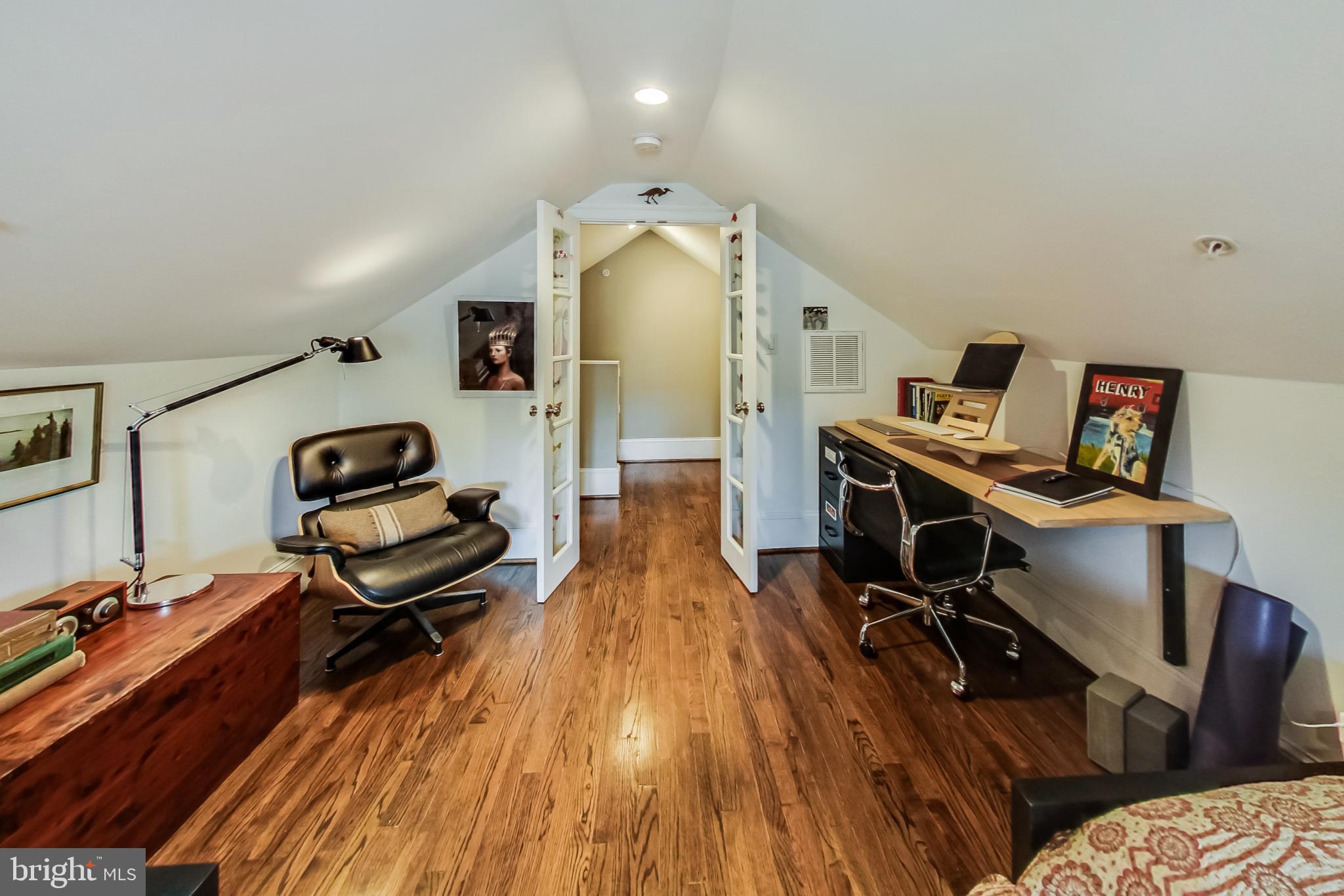 3324 18th Street Northwest, Unit 9 Washington, DC 20010 - Photo 32 of 44 a view of a workspace with furniture and wooden floor