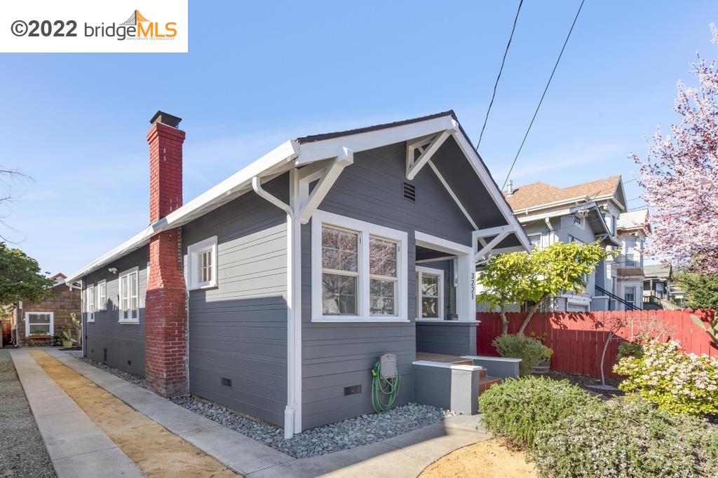 3221 Adeline Street Oakland, CA 94608 - Photo 1 of 1 a front view of a house with a yard