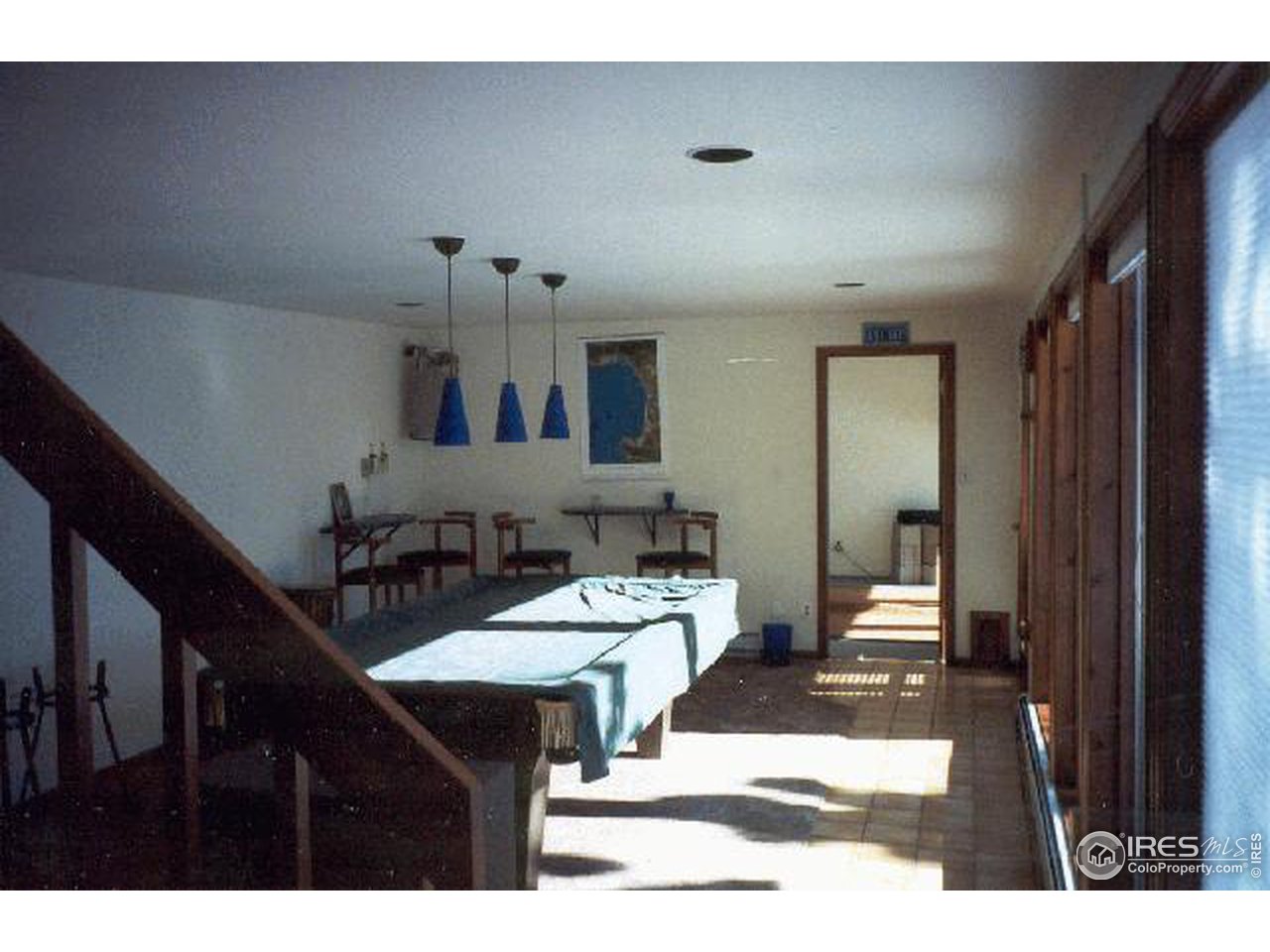 121 Chapman Road Boulder, CO 80302 - Photo 4 of 5 a view of a dining room with furniture and a chandelier