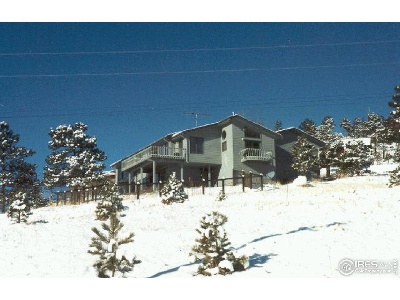 121 Chapman Road Boulder, CO 80302 - Photo 5 of 5 a view of a house with snow on the road